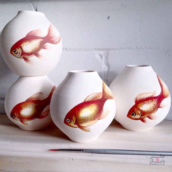 با الهام از طبیعت، نقاشی ماهی بر روی ظروف چینی/بانک عکس